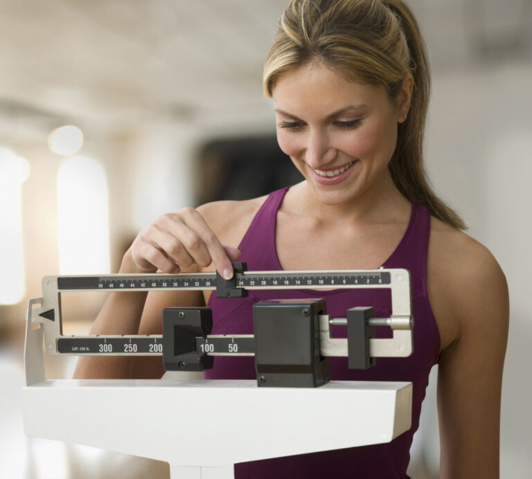 Woman weighing herself